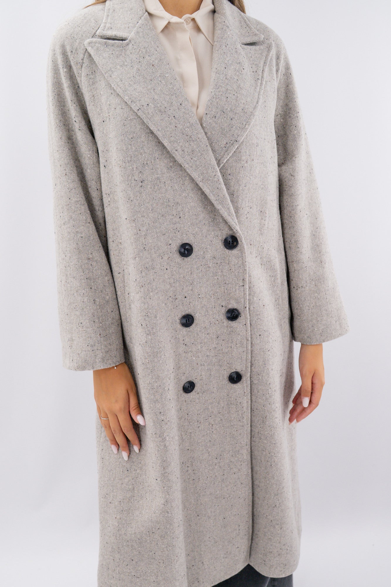 Cappotto oversize foderato in texture ad effetto melange.