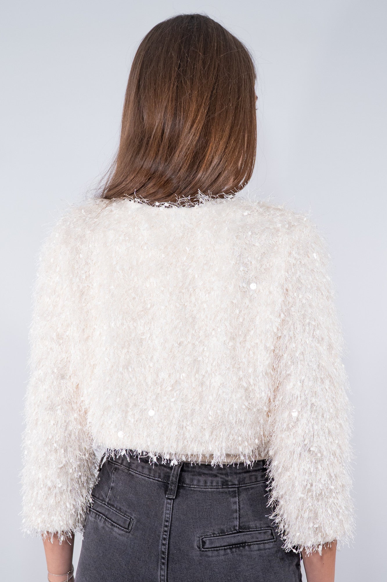 Giacchino coprispalle con  frange e paillettes