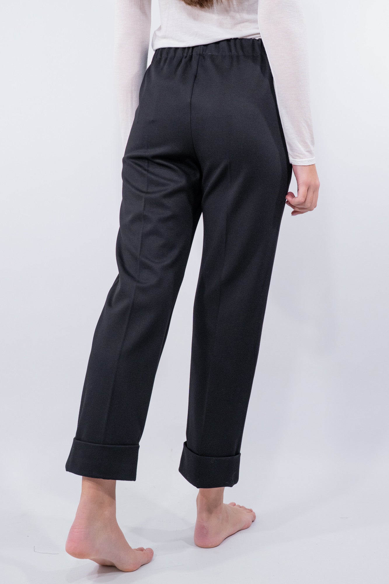 Pantalone con risvolto in punto Milano obliquo.