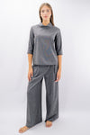 Pantalone palazzo in texture operata con pinces