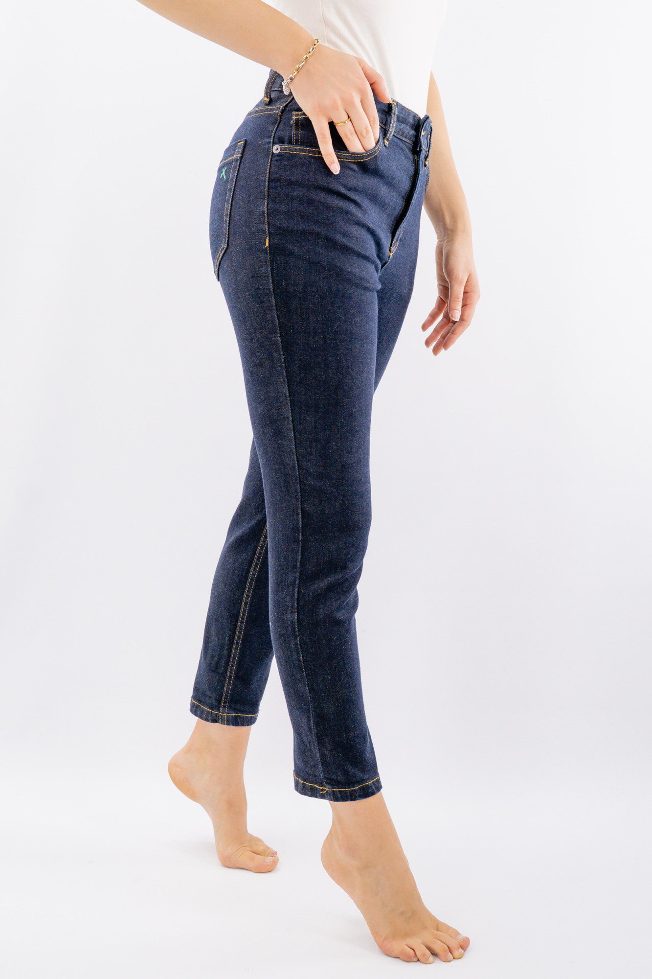 Jeans con x tasca posteriore