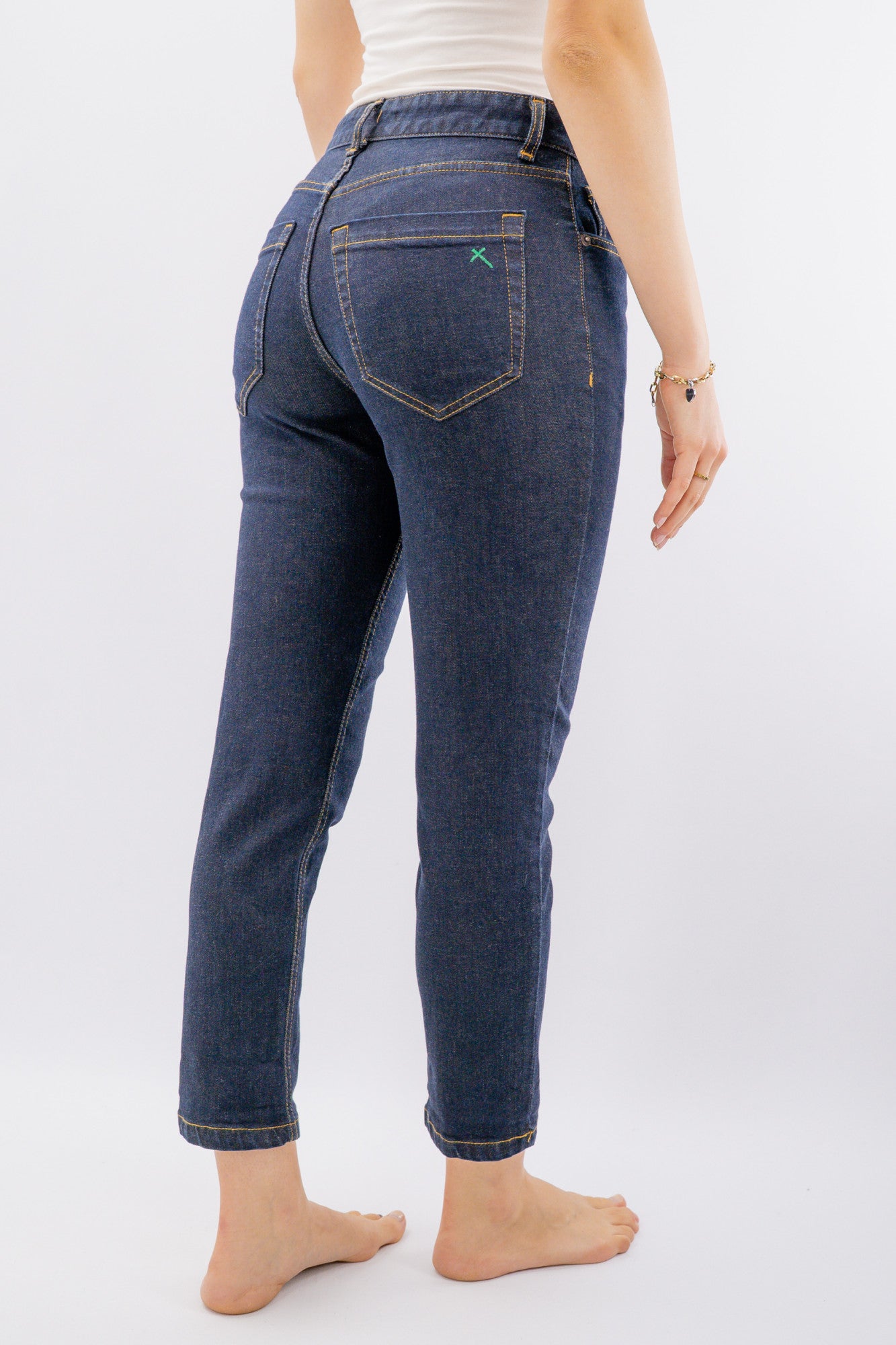 Jeans con x tasca posteriore