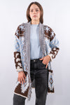 Cardigan lungo in maglia jacquard con profili frangiati