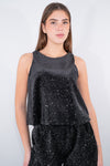 Top smanicato con paillettes