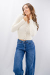 Cardigan corto effetto peluche con bottoni gioiello