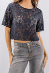 Blusa corta in pizzo a maniche corte