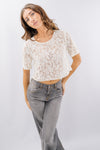 Blusa corta in pizzo a maniche corte