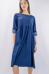 Abito midi in denim oversize con tasche laterali